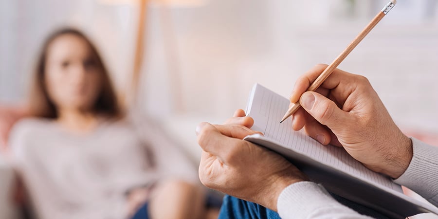 female with therapist